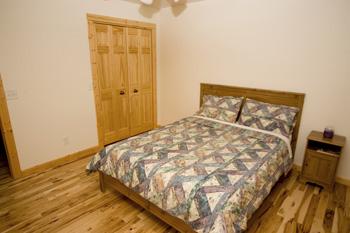 Spacious Bedrooms With Hickory Wood Flooring